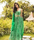 Polka printed green bustier with high waisted skirt & Coat